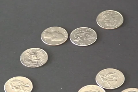 Quarters Fall. Stock Footage 8600376