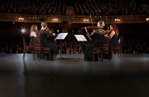Quartet performing on stage in theater Stock Photos