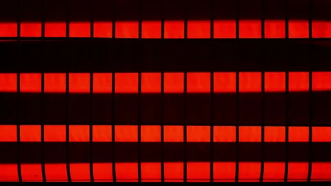 Quartz heater, red-hot elements under metal grid, close-up view. Video stock 306573894