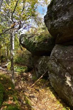 Quartz sandstone cliffs with vertical walls make up a bizarre Stone Town (Dev Stock Photos