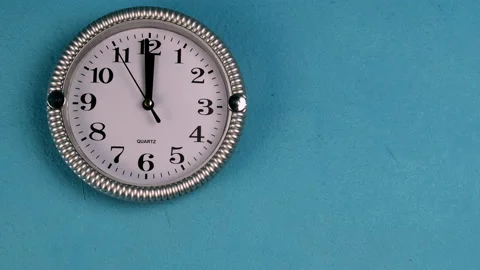 Quartz wall clock with second hand runs clockwise. The clock shows twelve oclock Stock Footage 149277093