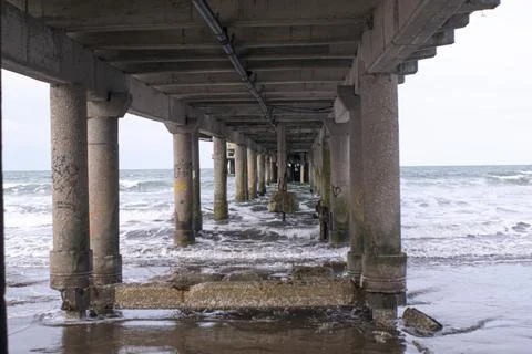 Quay on the seashore  Columns Stock Photos