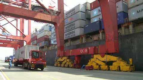 Quayside Pan Of Containers Being Loaded Stock Footage 10832511