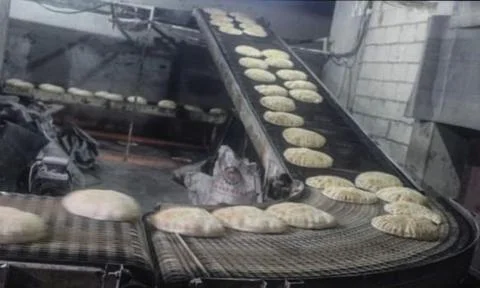 Quboos (Arabic Bread) making process Stock Photos