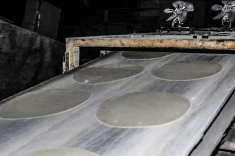 Quboos (Arabic Bread) making process Stock Photos