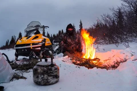 Quebec / Canada - Jan 10, 2017: A Cree warrior with snowmobile by his camp fi Stock-Fotos
