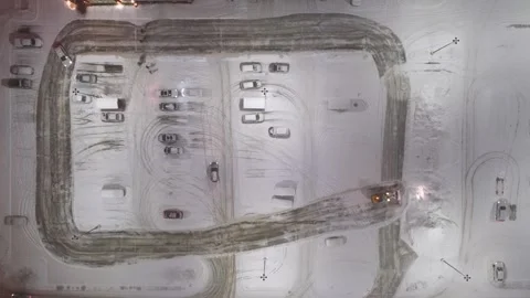 Québec, Canada Nov '25 - Night drone survey of snow-covered shopping center lot Stock Footage 324863697