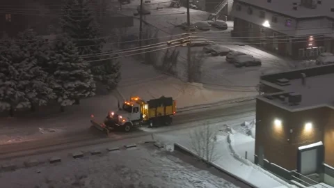 Québec, Canada Nov '25 - Salt truck plow applying deicing material on Stock Footage 324862338