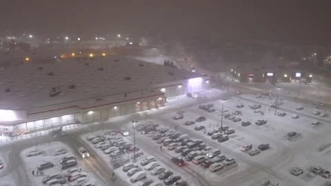 Québec, Canada Nov '25 - A silent mall lost beneath drifting snow and darkness Stock Footage 324862899