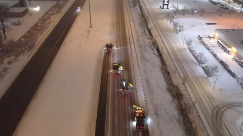 Québec, Canada Nov '25 - Winter road crews executing echelon plow strategy Stock Footage 324864406