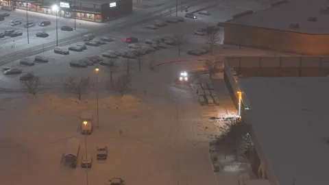 Québec, Canada Nov 3 '25 - Urban traffic moving through thick snowfall at night Stock Footage 324865158