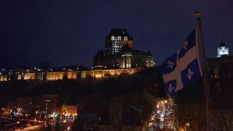 Quebec Flag boom up to Old Quebec and Frontenac Castle during curfew Stock-Footage 146963147
