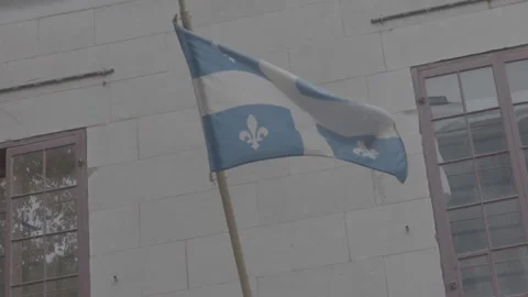 Quebec Provincial Flag Hanging during the Day in Montreal Video stock 146090528