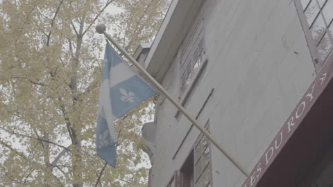 Quebec Provincial Flag Hanging during the Day in Montreal Video stock 146092149