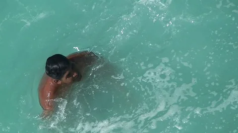 Quebrada cliff diver look around after jump. Mexico, Acapulco. Stock Footage 70518235