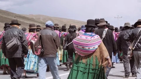 Quechua indigenous walking to a ceremony Stock Footage 77799132