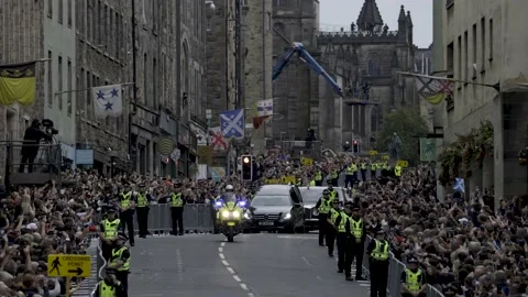 Queen Cortege on the Royal Mile Stock Footage 209483786