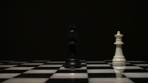 Queen defeating taking a king in chess Stock Footage 92525320