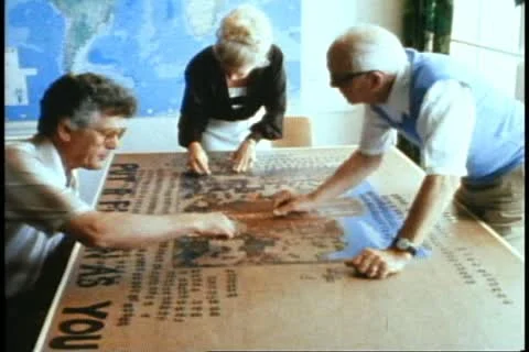 QUEEN ELIZABETH 2, 1982, QE2 World Cruise, Jigsaw puzzle with three people Stock Footage 11157628