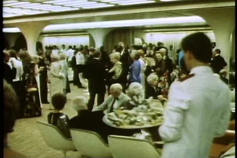 QUEEN ELIZABETH 2, 1985, Captains cocktail party on the QE2, crowd, wide shot Stock Footage 11610656
