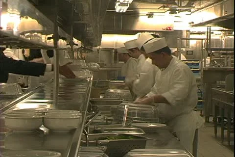 QUEEN MARY 2, 2004, Ocean liner, galley, kitchen, chefs on the hotline Stock Footage 20465186