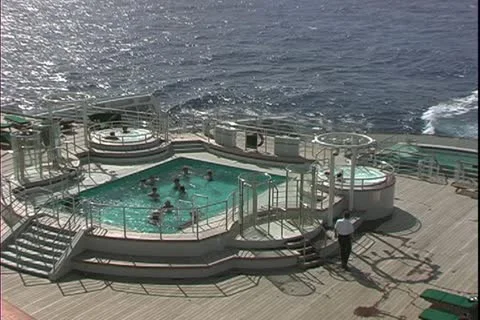 The Queen Mary 2, ocean liner, decks, pool, at sea, wide shot Stock Footage