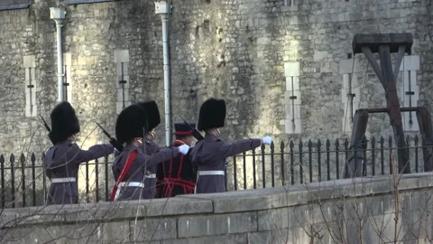 The Queen's Guard Escorting a Beefeater into Tower of London Video stock 145662990