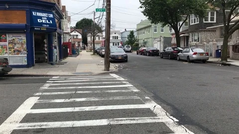 Queens NY Intersection w/pedestrian crossing Stock Footage 109060667