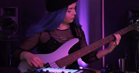 Queer pop beatmaker playing bass during the live performance in the club stage Video stock 158939210