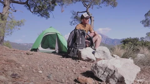 Quenching your thirst while camping, hydrator with water Stock Footage 201966214