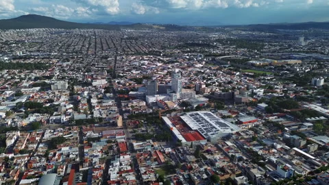 Queretaro city aerial view facing south with overcast sky mountains Mexico Video stock 346113653