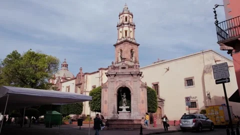 Queretaro downtown colonial Neptune statue and church Stock Footage 170384553