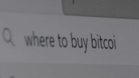 Query in the search bar. search where to buy bitcoin. someone is typing a word  Stock Footage 148955299