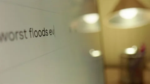 Querying on internet via web browser what the worst floods ever seen is, typing Stock Footage 301275392