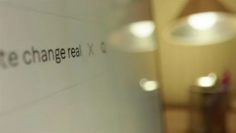 Querying whether climate change is real on internet web browser, closeup slider Stock Footage 300553845