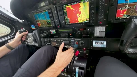 Quest Kodiak aircraft cockpit with pilot hands and controls during flight Stock Footage 314873604