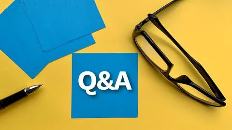 Question and answer text on blue notepad with glasses and yellow background Stock Photos