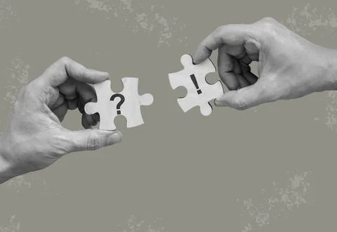 Question and exclamation puzzle piece held by hands for problem solving. 스톡 사진
