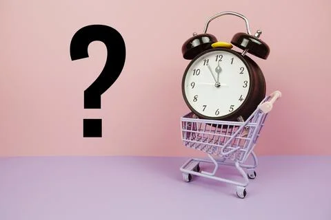 Question mark and alarm clock on yellow and purple background Stock Photos