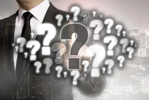 Question mark cloud is shown by businessman concept Stock Photos