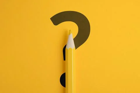 Question mark concept or FAQ. Sign under colored pencil Stock Photos