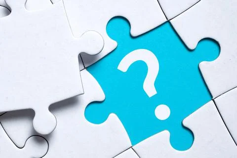 Question mark concept or FAQ. Sign in a puzzle Stock Photos