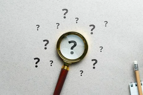 Question mark concept or FAQ. Sign under magnifying glass Foto stock