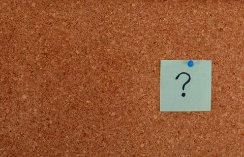 Question mark on a corkboard Concept of uncertainty inquiry problem-solving Stock Photos