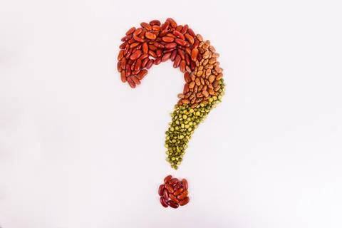 Question mark created with dry raw beans Stock Photos