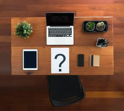 Question mark on the desk at office Stock Photos