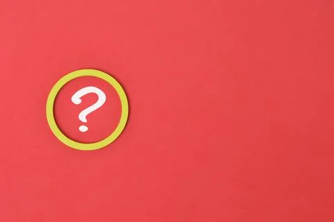 Question mark drawn on red background with copy space. Top view. Stock Photos