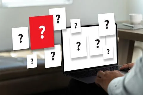 Question mark for FAQ problem young man looking computer Question mark Stock Photos