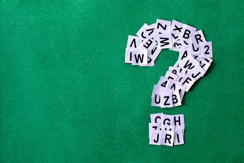 Question mark on green background with copy space made of paper Stock Photos