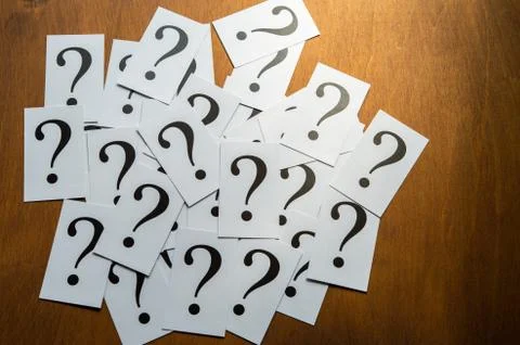 Question mark heap on table concept for confusion, question or solution Stock Photos